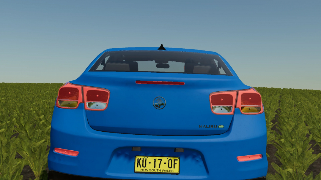 FS22 mod 2013 Holden Malibu v1.0.0.0 displayed in a field, showcasing its rear design.