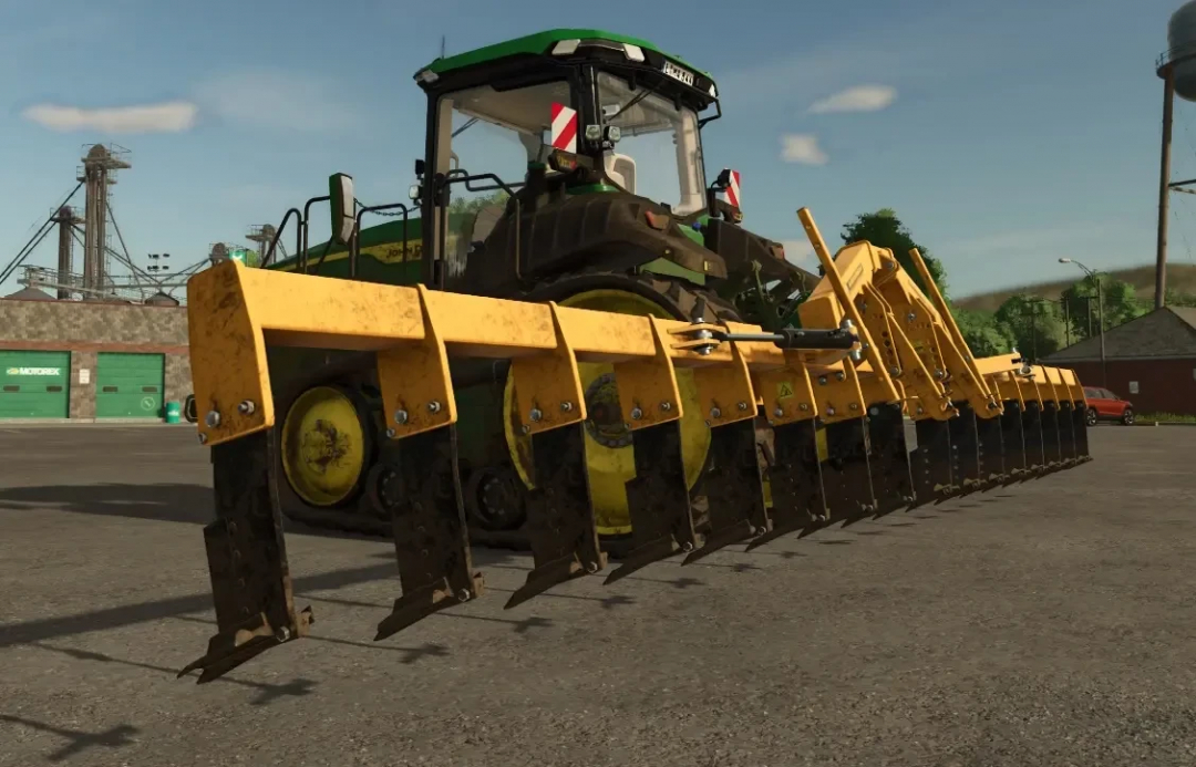 FS25 mod Agrisem Combiplow 11m in front of a tractor, showcasing farming equipment detail.