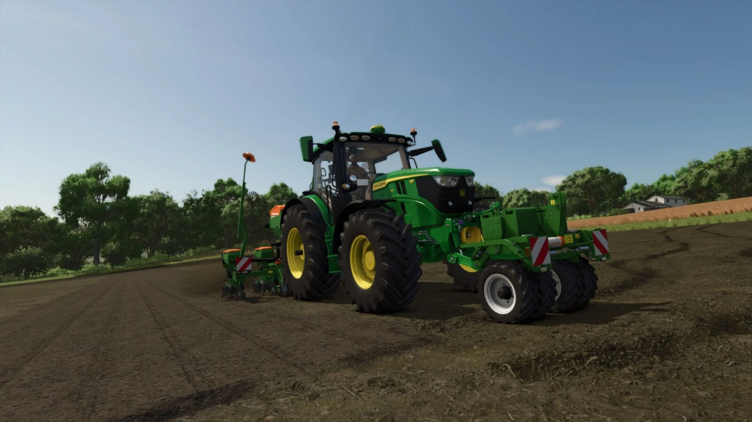 FS25 mods: Amazone T-Pack U v1.0.0.0, a green tractor with an attachment, in a field in Farming Simulator 25.