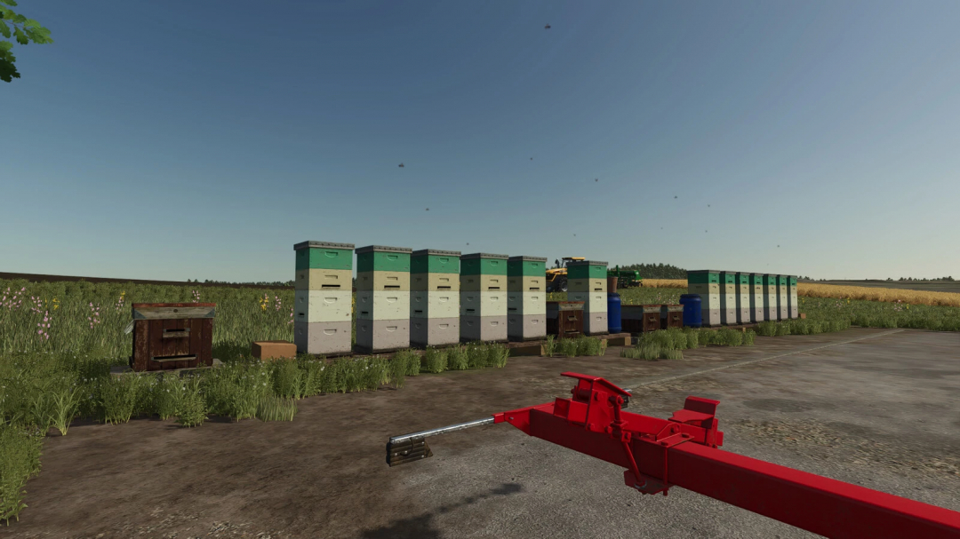 Beehives Pack v1.0.0.0 mod for Farming Simulator 25 featuring multiple beehives in a field.