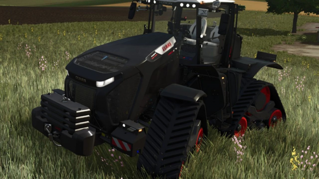 FS25 mod Claas Xerion 12 v1.0.0.3 tractor in a field, showcasing its modern design.