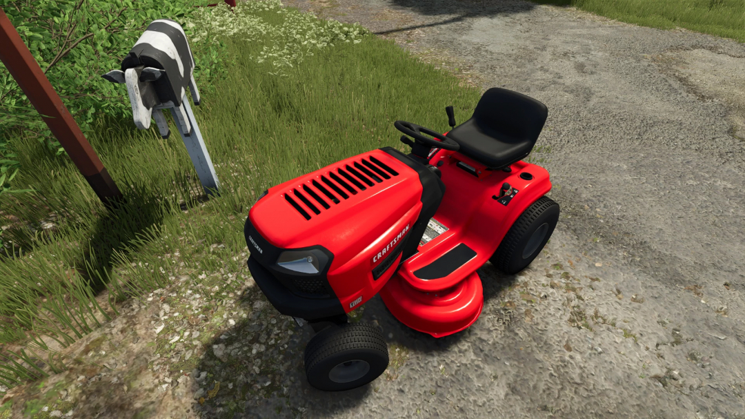 FS25 mod Craftsman T100 red lawn tractor near cow mailbox in Farming Simulator 25.