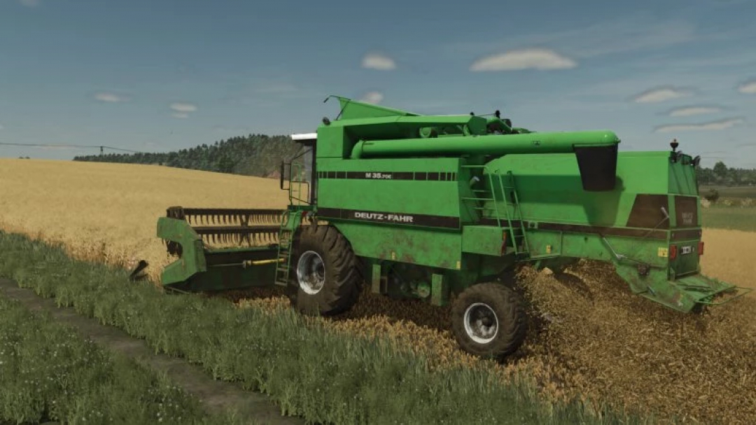 Deutz-Fahr M series harvester in a field, part of FS25 mods for Farming Simulator 25.