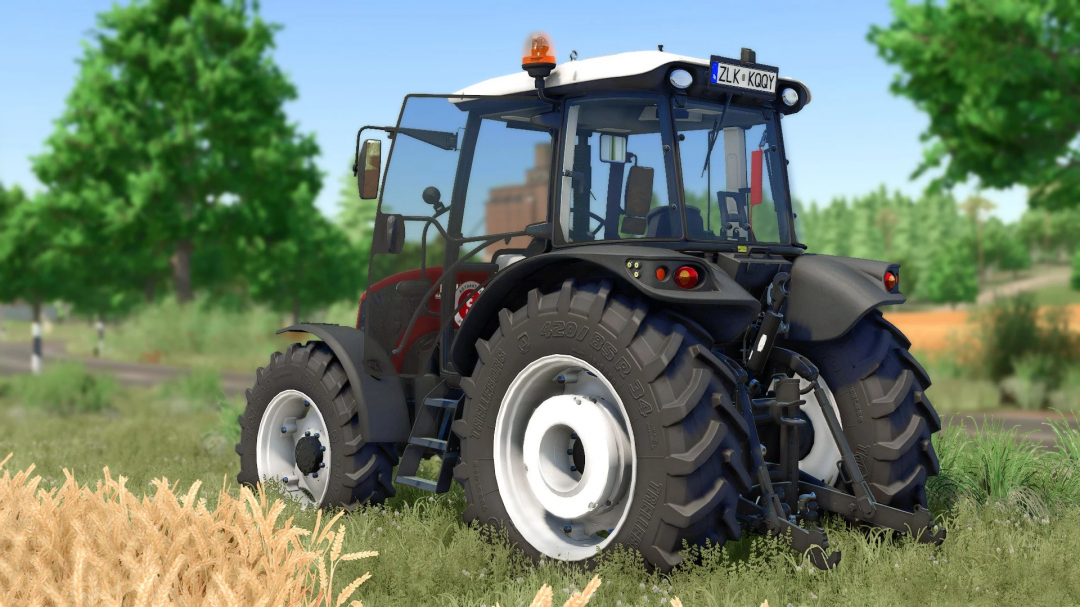 Erkunt 100-110 tractor mod in Farming Simulator 25, showcasing detailed rear view with lush greenery.