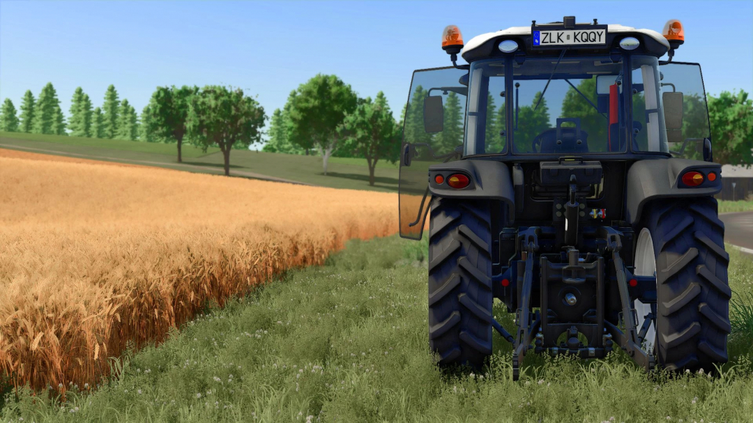 View of Farming Simulator 25 mod Erkunt 100-110 v1.0.0.0, showing tractor near wheat field against a backdrop of trees.