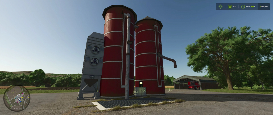 FS25 Fermenting Silo mod in Farming Simulator 25, showcasing red silos with equipment against a rural backdrop.