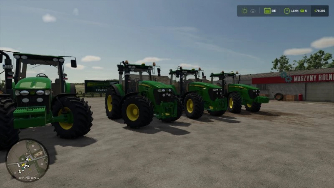 Four John Deere tractors in a farm setting in FS25. FS25 mods enhance gameplay with realistic vehicles.