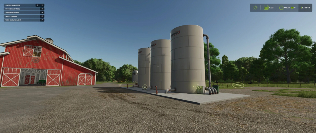 FS25 Liquid Storage Farm mod with silos and red barn in Farming Simulator 25.