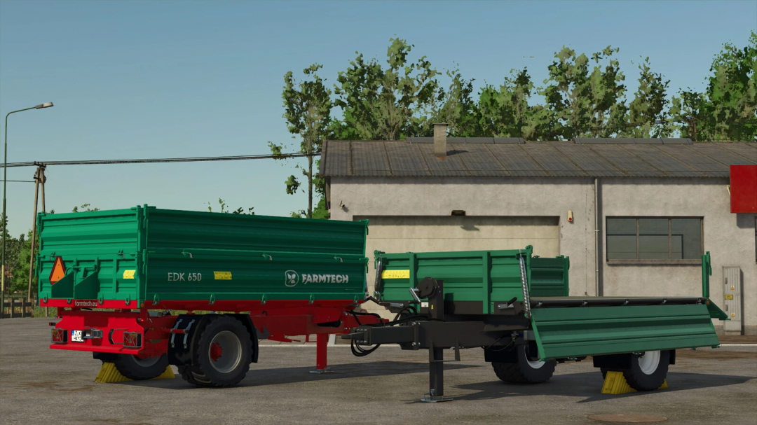 Farmtech EDK 650 trailer mod for FS25, showing green and red design, parked outside a building.