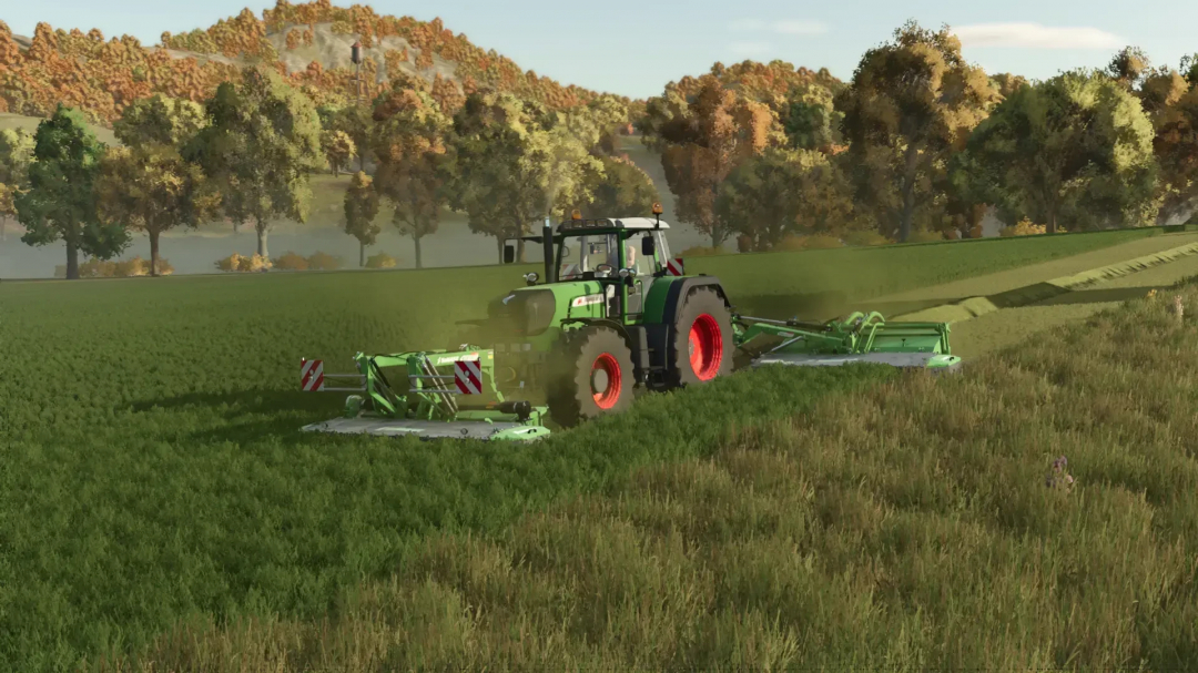 Fendt 900 Vario TMS mod in FS25 game mowing field amidst trees.