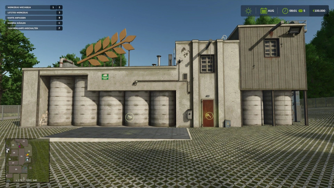 Factory building in FS25 HermannsEck mod with grain silo, displaying loading zone in Farming Simulator 25.