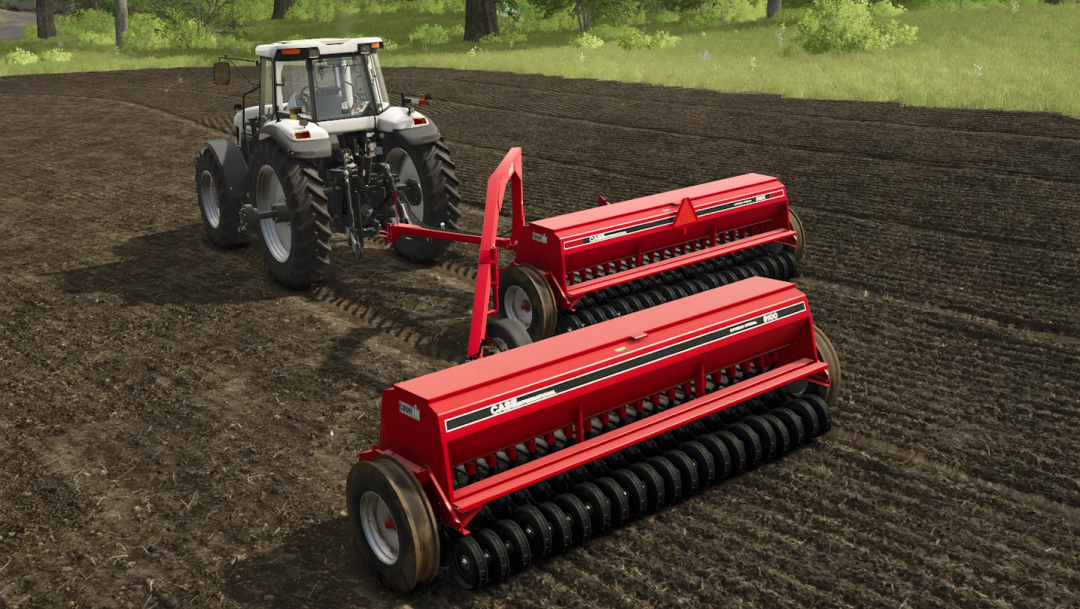 International 5100 Grain Drill mod in FS25 game, showing red drill attached to tractor on field.