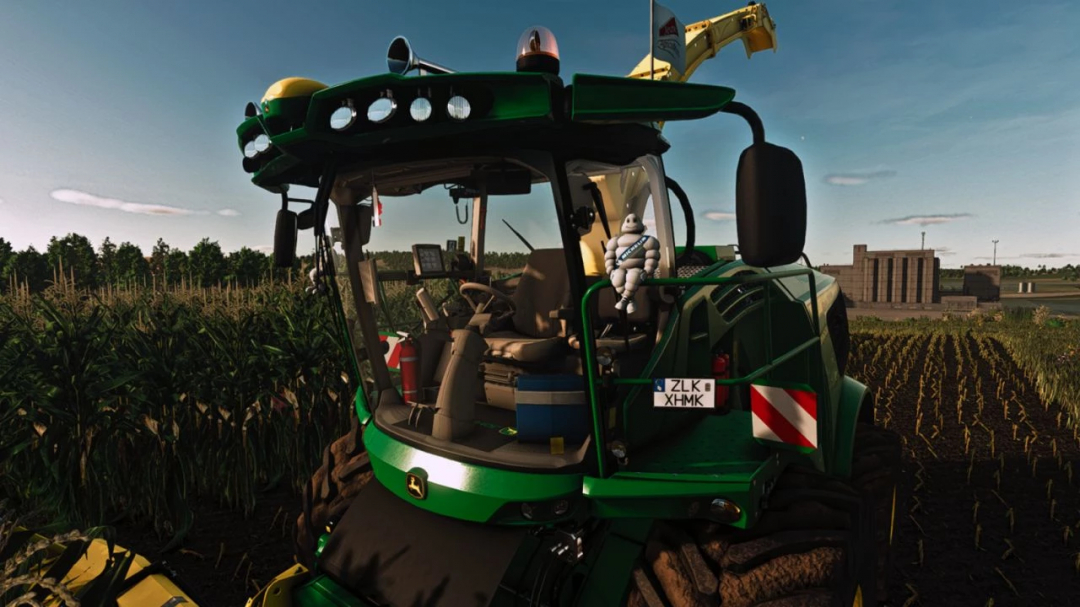 FS25 mod John Deere 9000 Series Edit v1.0.0.0 shown in a field, highlighting the tractor cabin details.