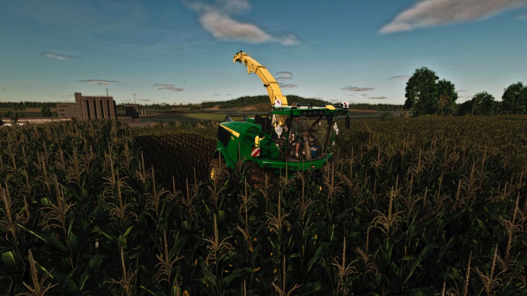 FS25 mod John Deere 9000 Series harvester in a cornfield, showcasing Farming Simulator 25 scenery.