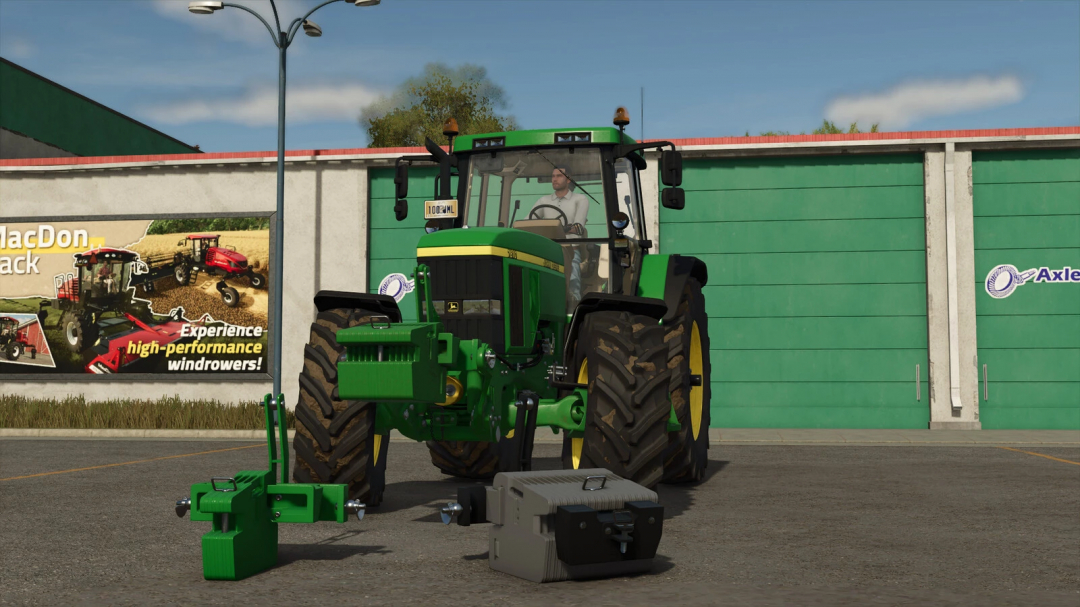 John Deere tractor with Slice Weight mod in FS25, displayed in front of a building.