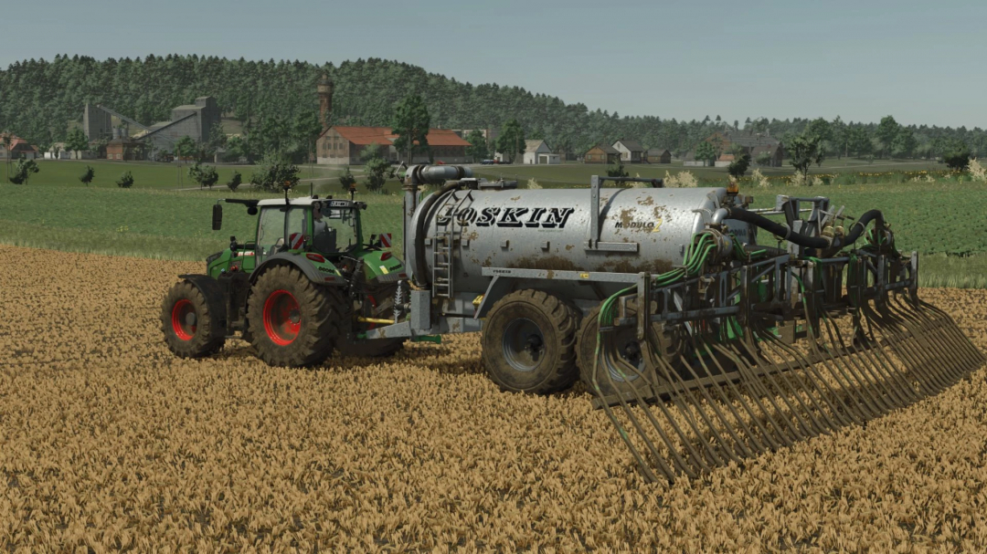 FS25 mod Joskin MODULO 2 v1.0.0.0 on a tractor in a field. Farming Simulator 25 mods enhance gameplay.