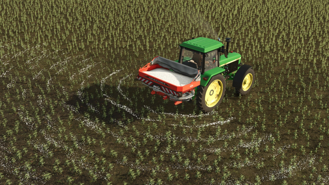 FS25 mod featuring Kuhn Axis 402 v1.0.0.0 in use, spreading fertilizer over a field.