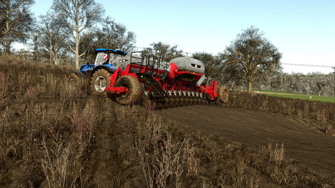 FS25 mod: Lizard SSM FFI v1.0.0.0 cultivating field with red and blue tractor, Farming Simulator 25 mod.