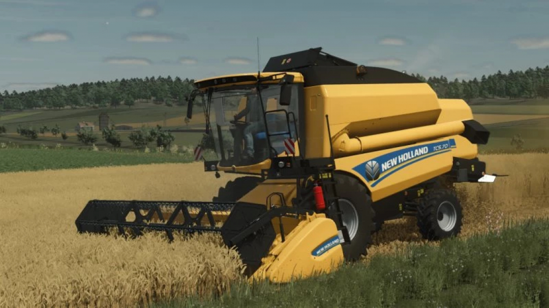 New Holland TC5 Series combine harvester in wheat field in FS25 mod.