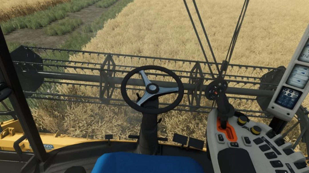 Interior view of New Holland TC5 Series combine harvesting wheat in FS25 mod.