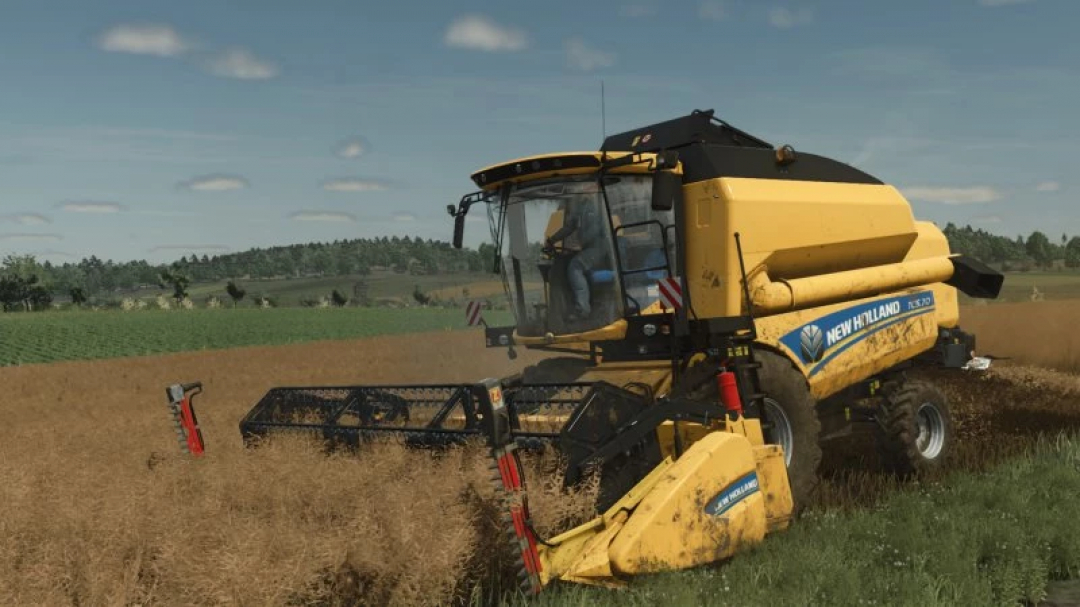 New Holland TC5 harvester in FS25 mod, cutting through a wheat field.