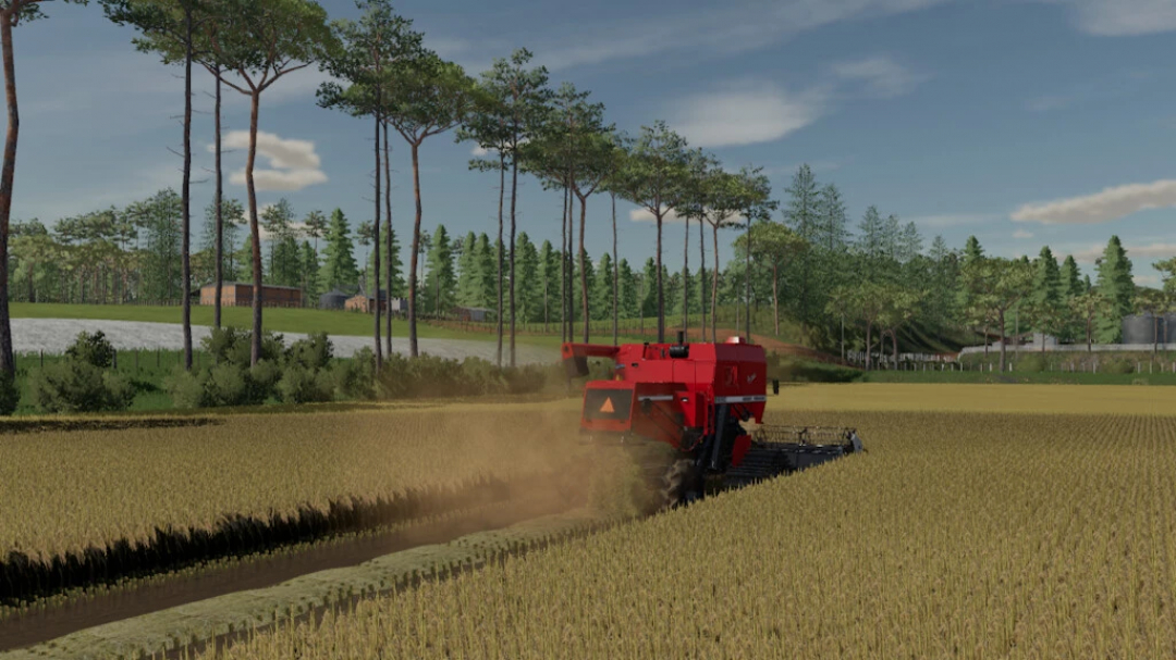 FS22 Pertile Map mod v1.0.0.0 showing a red harvester in a wheat field with trees and a farm in the background.