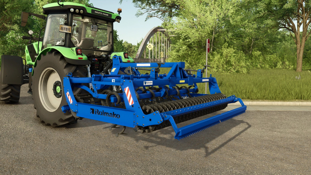 FS25 mod: Rolmako U684 v1.0.0.0 attached to a green tractor on a rural road.