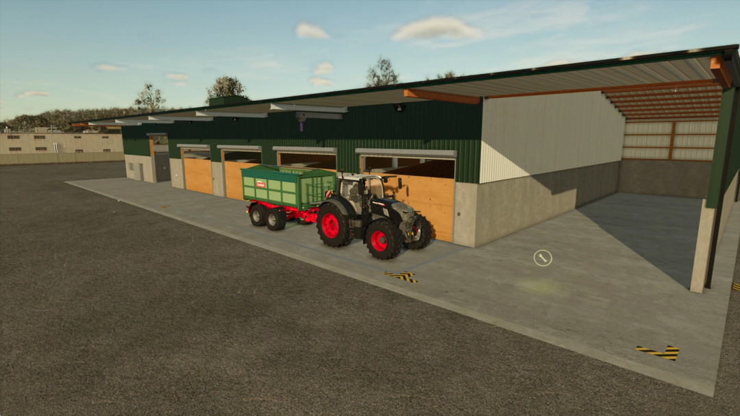 FS25 mod Rudolf Hoermann Silo v1.0.0.0 featuring a tractor with a trailer parked next to a silo building.