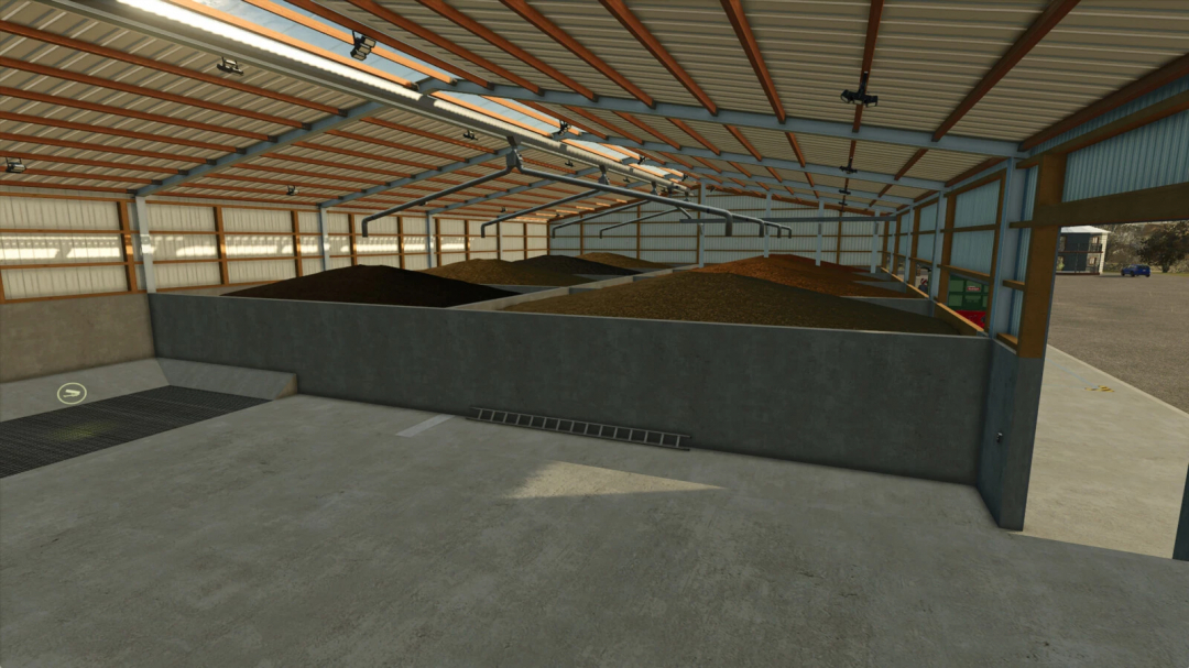 Interior of Rudolf Hoermann Silo in FS25, showing large piles of grain under a modern metal roof. FS25 mods enhance farming experience.