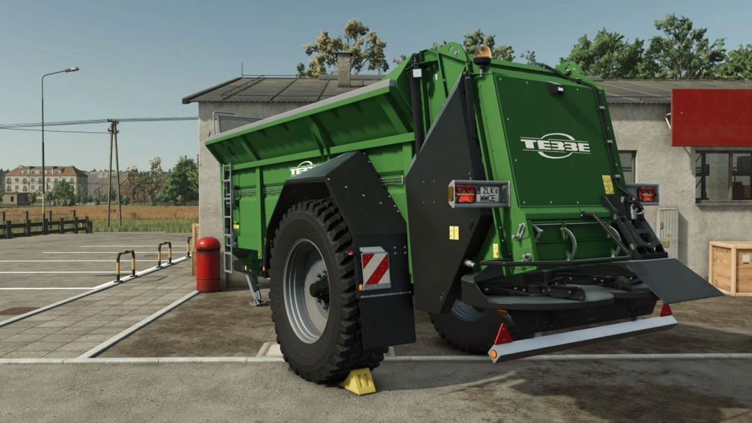 Tebbe MS140 mod in Farming Simulator 25, green trailer parked in a lot.