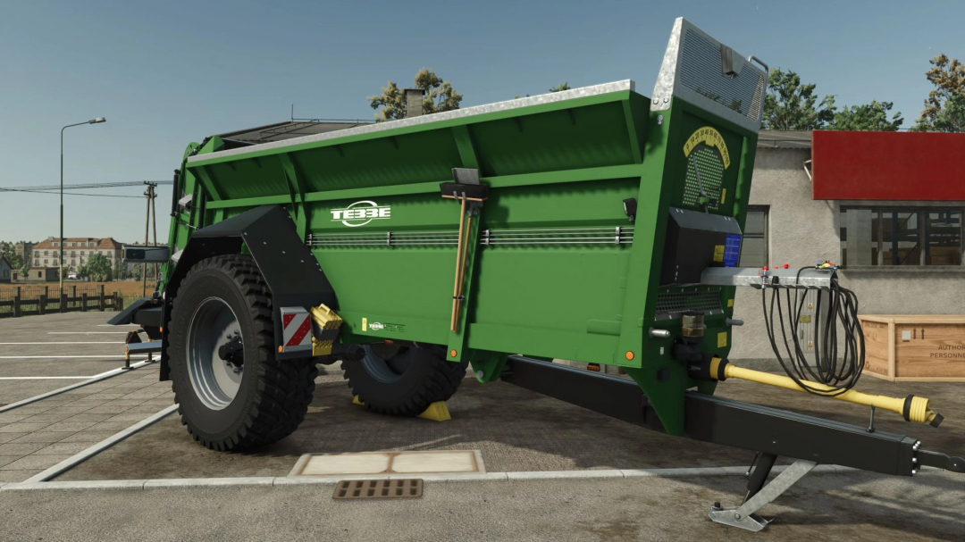 Tebbe MS140 mod in FS25, showcasing a green agricultural trailer with attachments and branding.