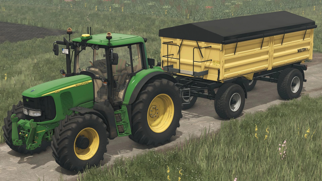 FS25 mod featuring a green tractor towing a yellow Wielton trailer on a farm road.