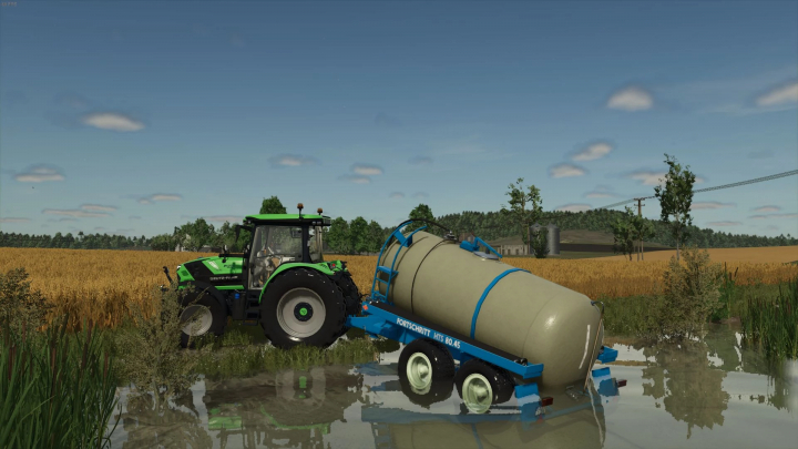 fs25-mods, FS25 mod HTS Pack v1.2.0.0: green tractor pulling a Fortschritt HTS 80.45 tanker across a waterlogged field.