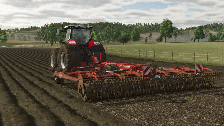 fs25-mods,  FS25 mod: A red tractor using the Kuhn Prolander 6000 cultivator in Farming Simulator 25, working on a freshly plowed field.