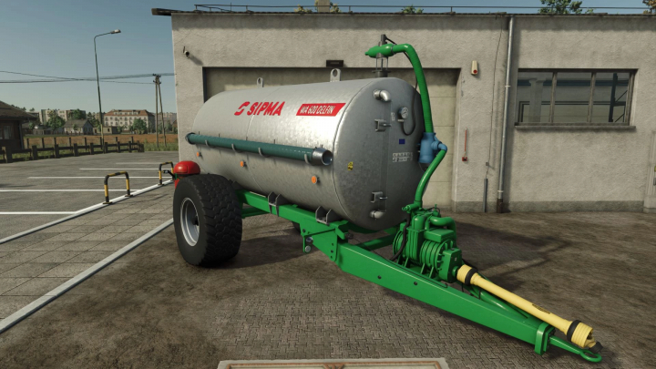 fs25-mods,  FS25 mod Sipma WA 600 Delfin v1.0.0.1, a green agricultural trailer in Farming Simulator 25, parked outside a building.