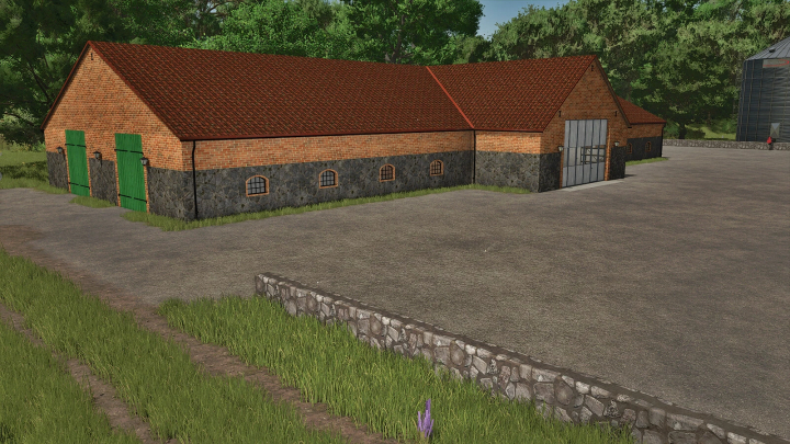 fs25-mods,  Stone barn with workshop mod in FS25, featuring brick and stone construction with green doors in a rural setting.