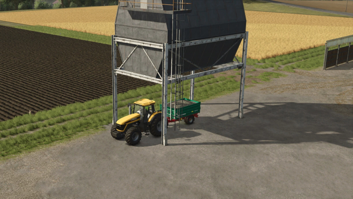 fs25-mods,  FS25 mod: Stone Silo v1.0.0.0 with tractor and trailer under silo on farm.