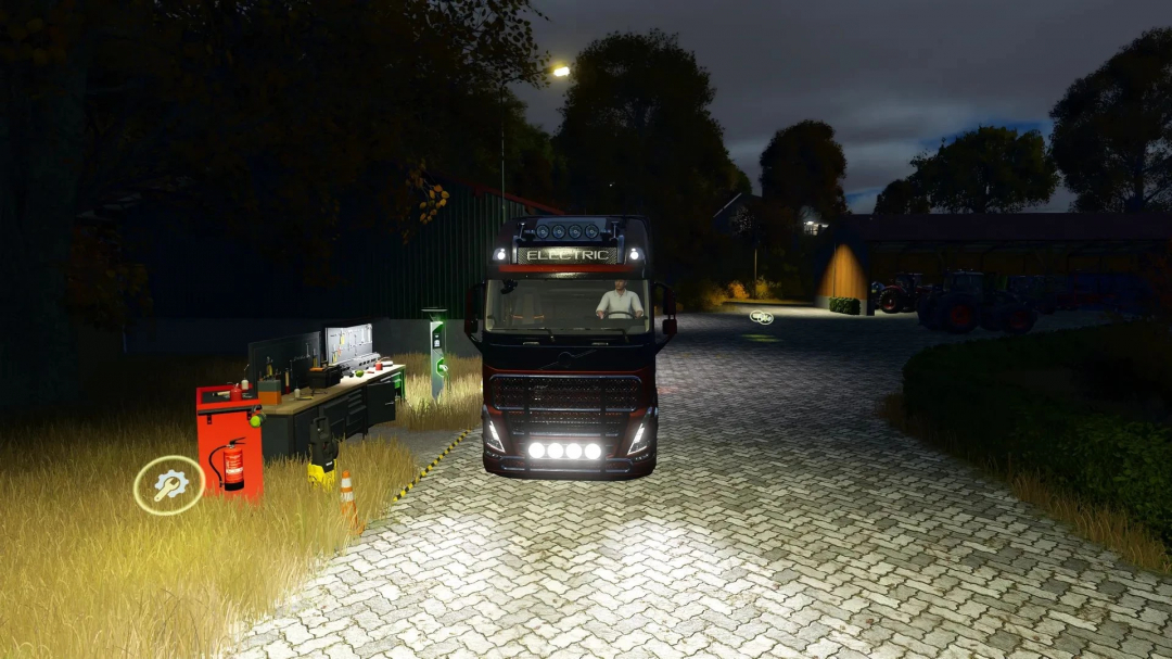 FS25 mod showing an automated workshop with an electric truck at night, highlighting the multifunctional features in Farming Simulator 25.