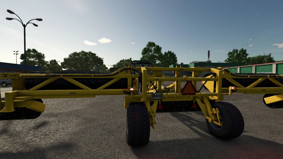 Claydon Cambridge Rolls mod in Farming Simulator 25, featuring yellow agricultural equipment with visible rolls and tires.