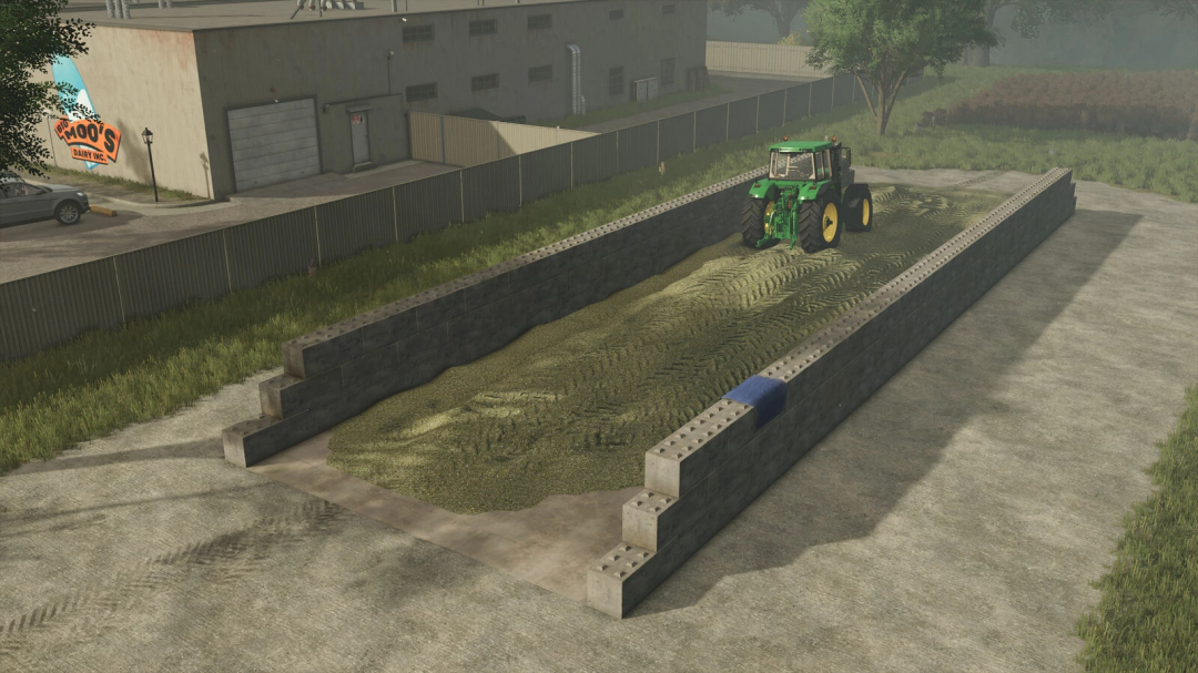 FS25 mod Concrete Blocks Silo Pack v1.0.0.0 featuring a tractor on silage in a concrete silo.