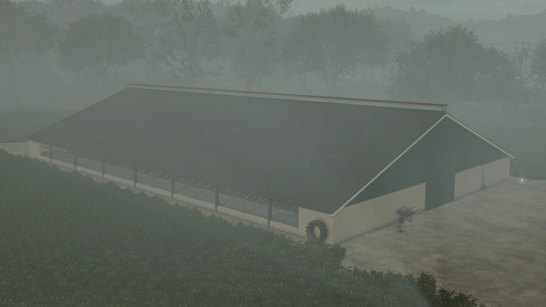 FS25 mod Cowshed Pack v1.0.0.0 features a large farm cowshed surrounded by misty greenery in Farming Simulator 25.