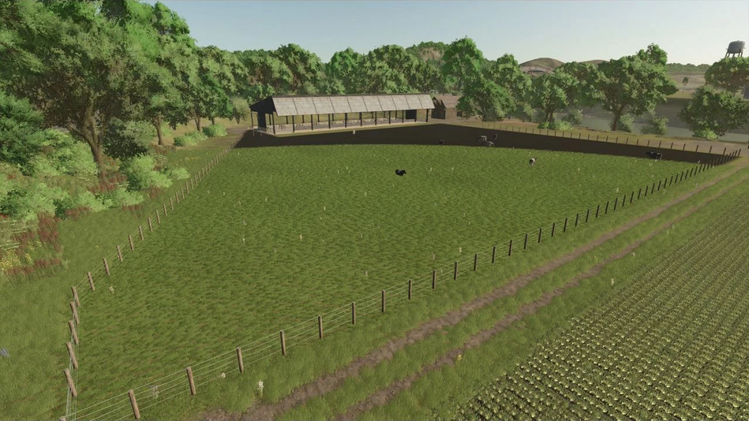 FS25 mod Enclosure for 150 dairy cows in Farming Simulator 25 showing a fenced field with a barn surrounded by trees.