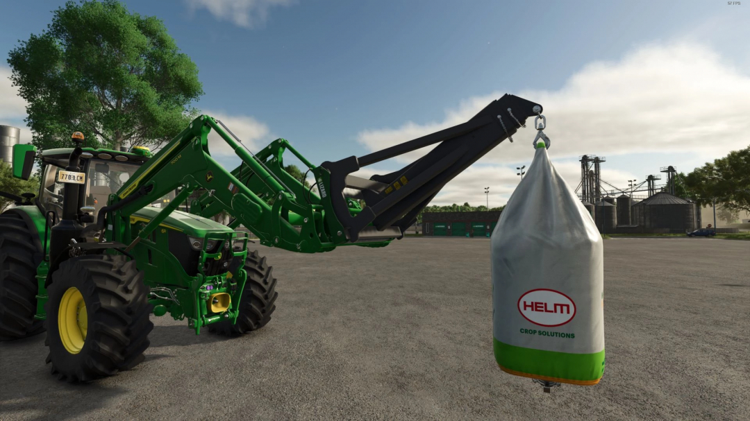 FS25 mod showing a front loader to wheel loader adapter lifting a large bag labeled HELM Crop Solutions in Farming Simulator 25.