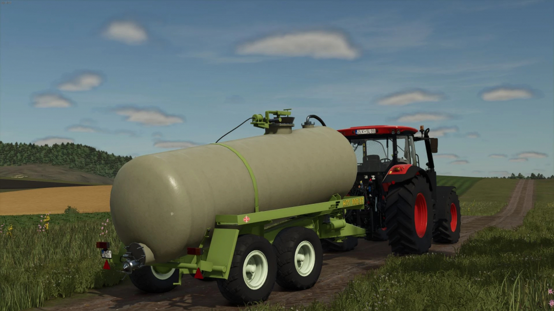 Tractor with HTS tanker trailer on a rural road in FS25 HTS Pack mod.