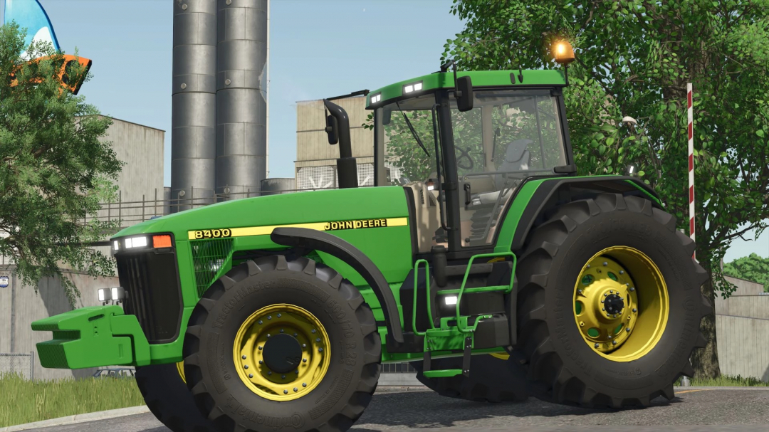 John Deere 8400 tractor mod in Farming Simulator 25, showcasing detailed design and realistic farming environment.