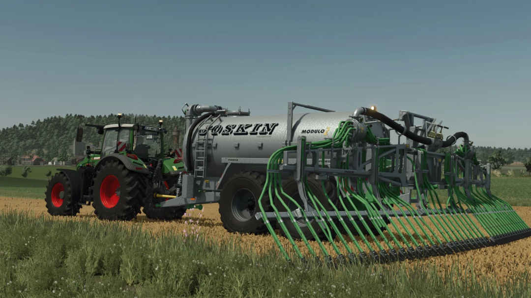 FS25 mod Joskin MODULO 2 v1.0.0.1, a slurry tanker attached to a tractor in a field.