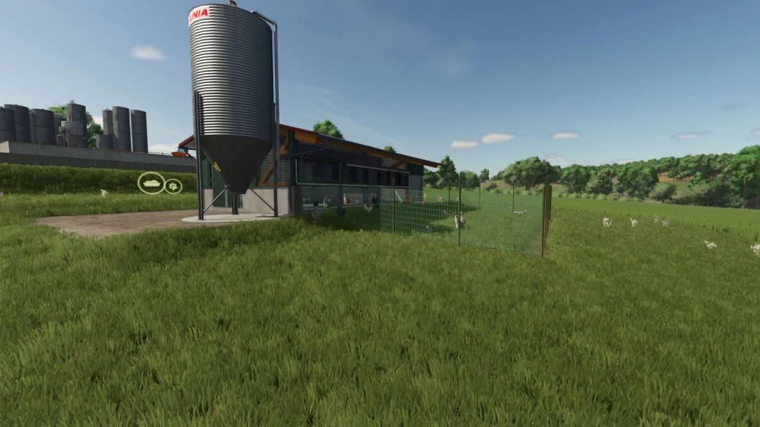 Larger animal stables mod in FS25 featuring a modern silo and fenced pasture.