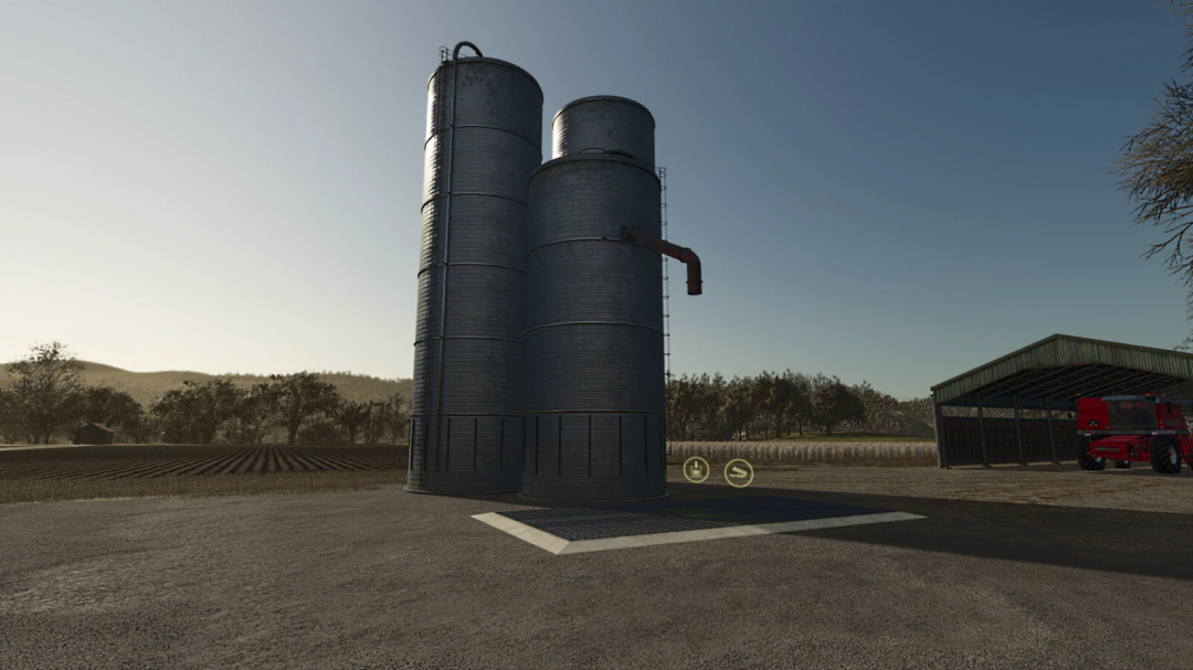 Low Cost Grain Silo mod for FS25 with three silos next to a barn in rural setting.