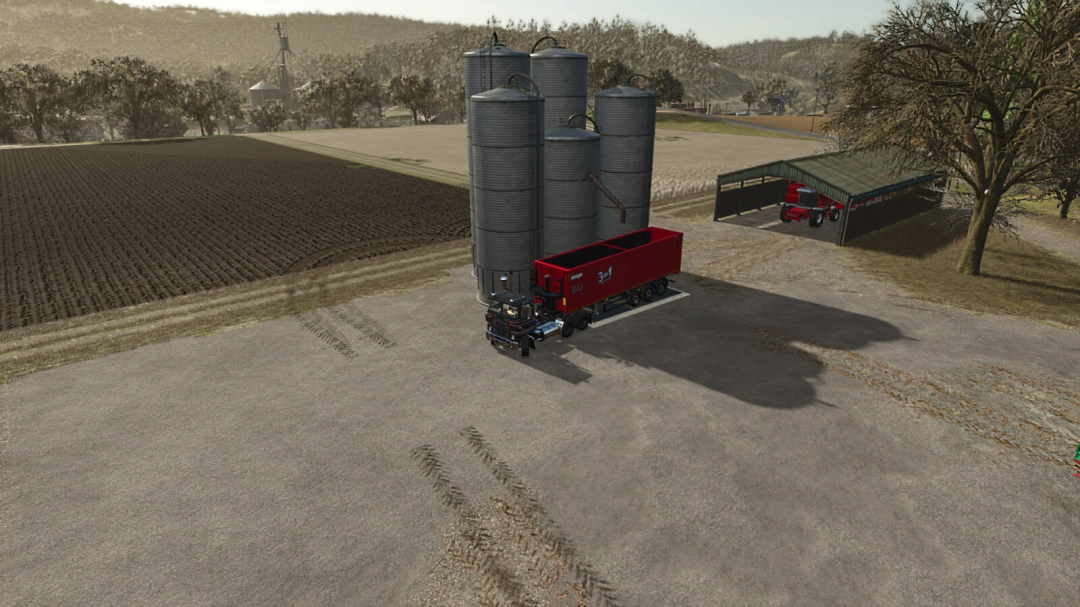 Low Cost Grain Silo mod for FS25 with truck trailer loaded, showing farm landscape.