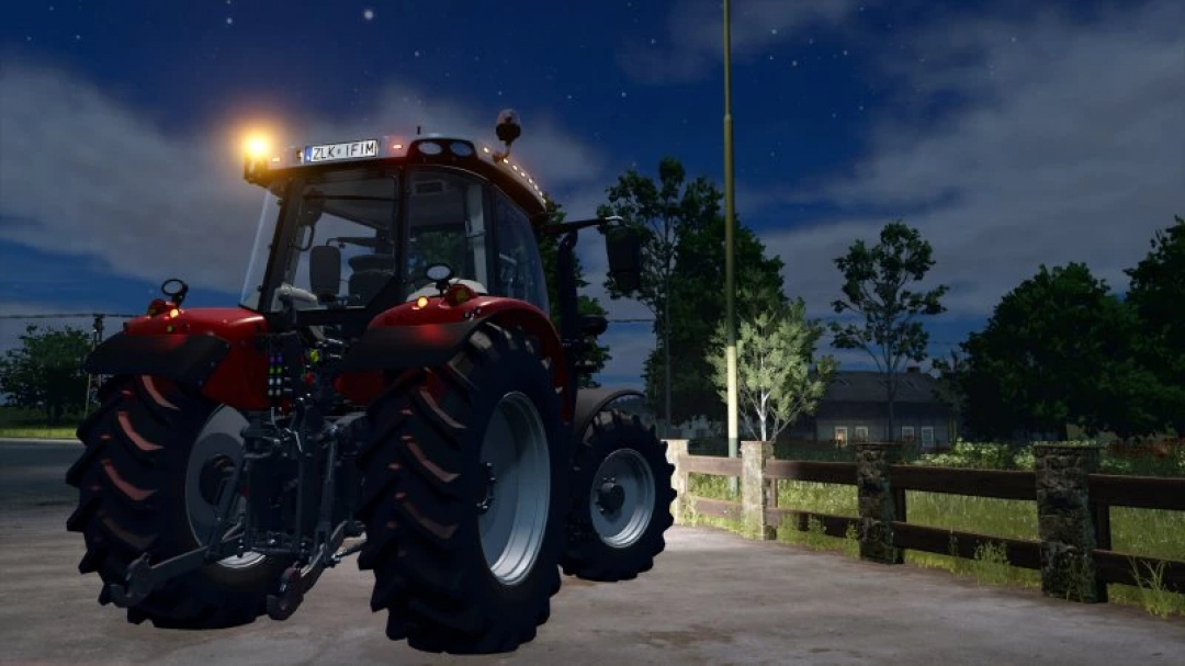 Massey Ferguson 5700S tractor mod in FS25, nighttime setting with rear lights on.